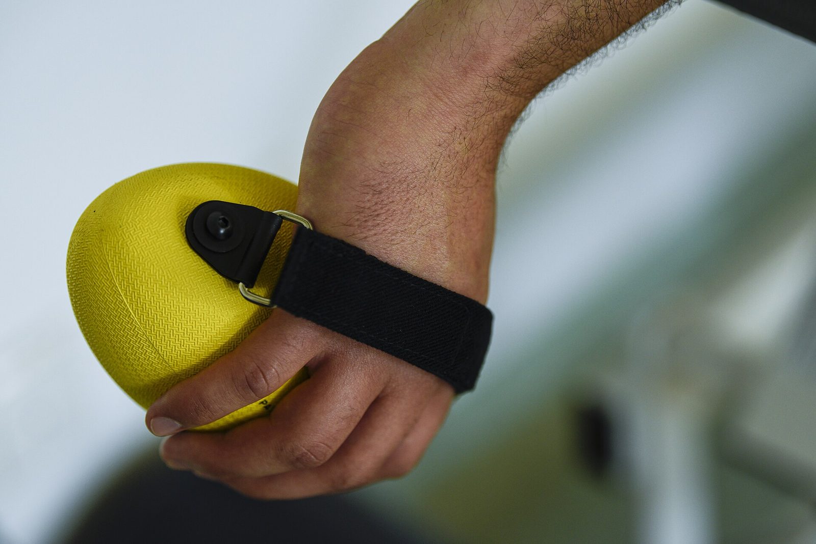 Patient performing resistance-band rehabilitation work under supervision.