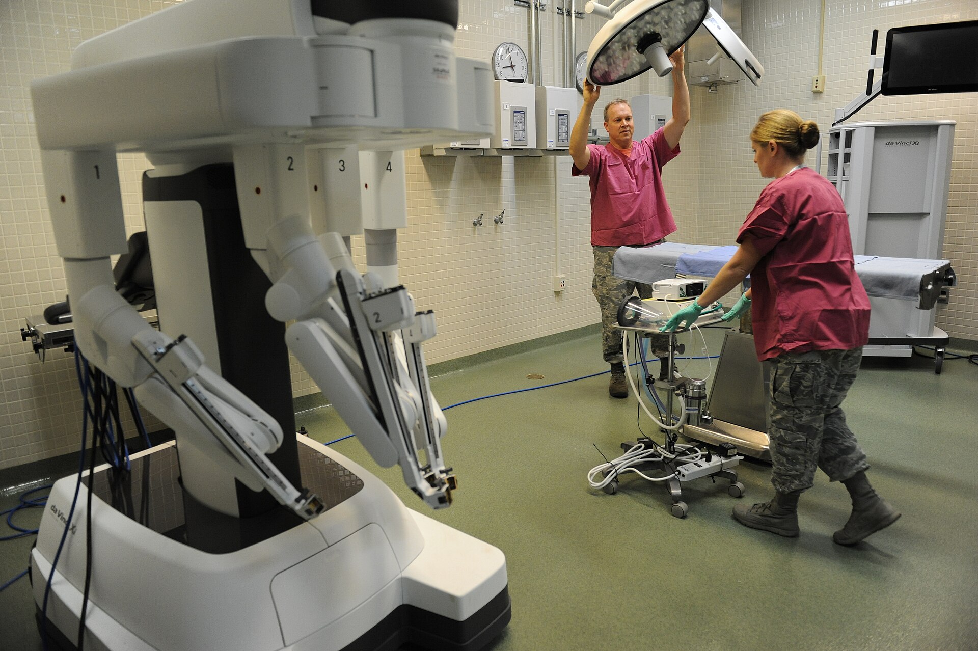 Surgeons training on a robotic surgical system during a course at Keesler Air Force Base.