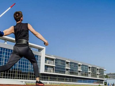 male athlete javelin throw at track and field competition